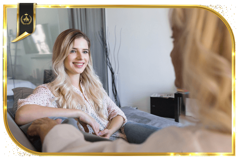 Girl smiling and listening to doctor